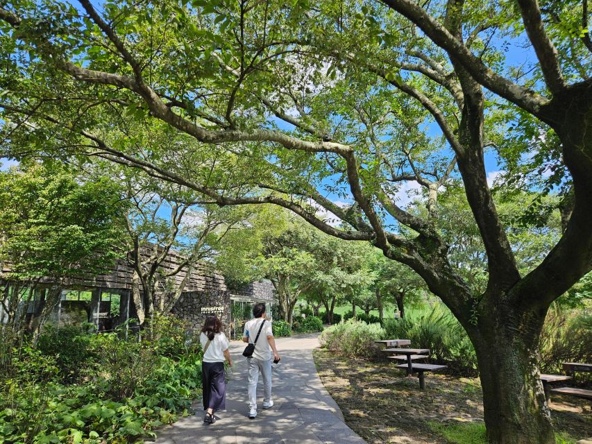 Jeju Island: Full-Day SouthWest Bus Tour with Entry Fees - Songaksan to Bomunsa: Volcanic Trails and a Seaside Temple Finish