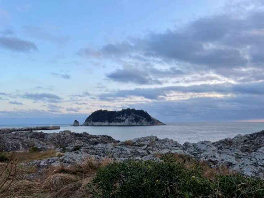 Jeju: Seogwipo City Walking Tours with Sunset - Saeyeongyo Bridge at sunset, plus the bridge of new relationships