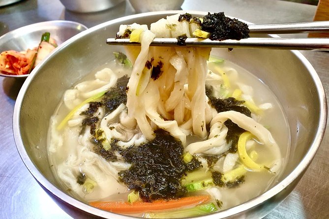 Private Downtown Seoul Food & Market Tour with 8+ Tastings - Bukchon Hanok Village hill walk: traditional homes, real neighborhood texture