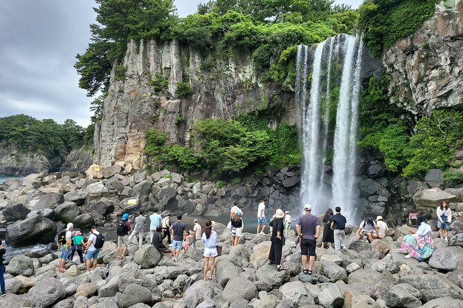 Private Tour in South and East in jeju island - Stop 1: Jeongbang Waterfall, the sea-meets-water photo moment
