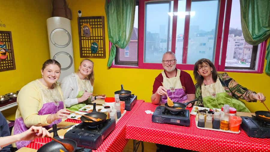 Seoul: Korean Cooking Class at a Local Home and Market Tour - Cooking four main dishes, hands-on style