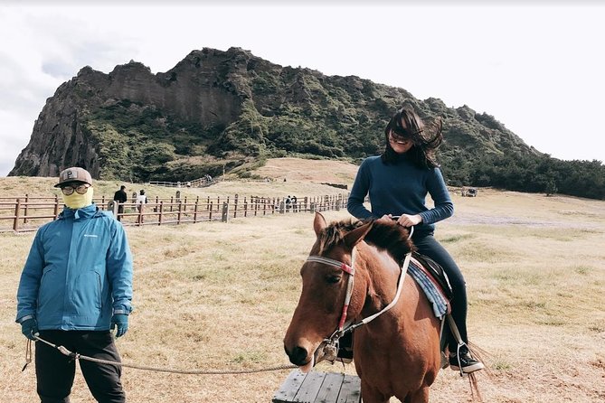 UNESCO Jeju Full Day Tour Package By Taxi - Stop 3: Seongsan Ilchulbong, Women Diver Show, and the 182-meter crater look